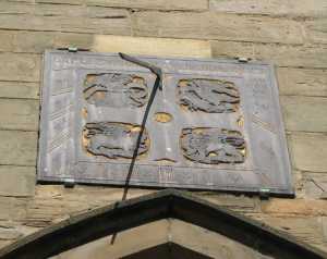 Sundial on Leicester cathedral with shadow.